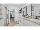 Elegant bathroom with dual vanities, granite countertops, and a glass-enclosed shower at 1717 W Roma Ave, Phoenix, AZ 85015