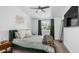 Serene bedroom with plush carpet, ceiling fan, generous natural light, and a calming color scheme at 1717 W Roma Ave, Phoenix, AZ 85015