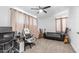 Versatile bedroom with gaming setup, comfortable seating, and carpet flooring at 1717 W Roma Ave, Phoenix, AZ 85015