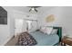 Comfortable bedroom featuring a queen-size bed, ample lighting, and an en-suite bathroom at 1717 W Roma Ave, Phoenix, AZ 85015