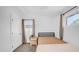 Cozy bedroom with natural light, carpeted floor, and neutral decor at 1717 W Roma Ave, Phoenix, AZ 85015