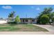 Inviting single-Gathering home featuring a well-manicured lawn and mature trees at 1717 W Roma Ave, Phoenix, AZ 85015