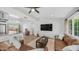 Open-concept living area featuring stylish decor and seamless kitchen access at 1717 W Roma Ave, Phoenix, AZ 85015
