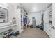 Spacious walk-in closet with custom shelving, ample storage space for clothes and shoes, and a vanity area at 1717 W Roma Ave, Phoenix, AZ 85015