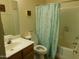 Bathroom with a toilet, shower/tub combo, and a light-colored vanity sink at 20282 N 104Th Ave, Peoria, AZ 85382