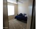 Cozy bedroom featuring a daybed with decorative pillows and ceiling fan at 20282 N 104Th Ave, Peoria, AZ 85382