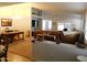 Spacious living room with neutral carpet, open layout, and bonus office space at 20282 N 104Th Ave, Peoria, AZ 85382