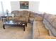 Comfortable living room featuring a plush sectional sofa and coffee table at 20282 N 104Th Ave, Peoria, AZ 85382