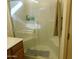 Shower stall with glass doors, a towel, and bath products at 20282 N 104Th Ave, Peoria, AZ 85382