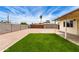 Spacious backyard featuring gravel, green turf and block fencing for added privacy and outdoor enjoyment at 2130 W Colter St, Phoenix, AZ 85015