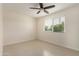 Comfortable bedroom with tile flooring, natural light, and a ceiling fan at 2130 W Colter St, Phoenix, AZ 85015