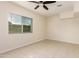 Neutral bedroom offering natural light and easy to clean tile flooring at 2130 W Colter St, Phoenix, AZ 85015