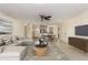 Bright living room featuring a comfortable sofa, ceiling fan, and an open layout perfect for entertaining at 2130 W Colter St, Phoenix, AZ 85015