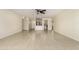 Open-concept living room with tile flooring leading to a breakfast bar and kitchen area at 2130 W Colter St, Phoenix, AZ 85015
