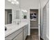 Elegant bathroom with double vanity, modern faucets, and a view towards a separate toilet and shower area at 24047 W Cocopah St, Buckeye, AZ 85326