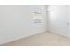 This bedroom has neutral carpet, a window for natural light, and a closet with sliding doors at 24047 W Cocopah St, Buckeye, AZ 85326