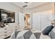 Stylish bedroom with a space-themed art, dresser, and convenient closet at 24047 W Cocopah St, Buckeye, AZ 85326