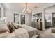 Relaxing bedroom showcasing mirrored decor, modern light, and ensuite access at 24047 W Cocopah St, Buckeye, AZ 85326