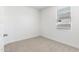 Bright bedroom featuring a window with neutral carpet at 24047 W Cocopah St, Buckeye, AZ 85326