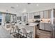 Open kitchen featuring a large island, stainless steel appliances, and modern fixtures at 24047 W Cocopah St, Buckeye, AZ 85326