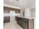 Well-appointed kitchen featuring a central island, stainless steel dishwasher, and ample counter space at 24047 W Cocopah St, Buckeye, AZ 85326