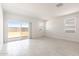 Bright living room with sliding glass doors to backyard and bright natural light at 24047 W Cocopah St, Buckeye, AZ 85326