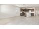 Open concept living space with kitchen island and stainless steel appliances at 24047 W Cocopah St, Buckeye, AZ 85326
