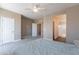 This bedroom offers neutral tones, a ceiling fan and access to the bathroom and walk-in closet at 2821 S Skyline Dr # 157, Mesa, AZ 85212