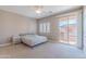 The bedroom has lots of natural light with access to a private outdoor balcony at 2821 S Skyline Dr # 157, Mesa, AZ 85212