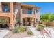 Charming two-story home with a well-manicured yard and a welcoming entrance with desert landscaping at 2821 S Skyline Dr # 157, Mesa, AZ 85212