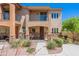Charming two-story home with a well-manicured yard and a welcoming entrance with desert landscaping at 2821 S Skyline Dr # 157, Mesa, AZ 85212