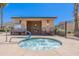 Community hot tub and pool house view featuring pool rules, lounge chairs, and desert landscaping at 2821 S Skyline Dr # 157, Mesa, AZ 85212