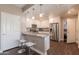Modern kitchen features white cabinets, stainless steel appliances, granite countertops, and a breakfast bar with seating at 2821 S Skyline Dr # 157, Mesa, AZ 85212