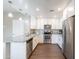 Modern kitchen with stainless steel appliances, granite countertops, and white cabinetry at 2821 S Skyline Dr # 157, Mesa, AZ 85212