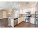 Modern kitchen with stainless steel appliances, granite countertops, and white cabinetry at 2821 S Skyline Dr # 157, Mesa, AZ 85212