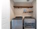The laundry room features a washer and dryer as well as shelving for storage at 2821 S Skyline Dr # 157, Mesa, AZ 85212