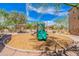View of a community playground with picnic tables, green slides, and desert landscaping at 2821 S Skyline Dr # 157, Mesa, AZ 85212