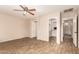 Bedroom showcasing wood-look tile flooring and a doorway to a walk-in closet at 29161 N Lilly Ln, San Tan Valley, AZ 85143
