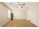 This bright bedroom has tile floors, neutral walls and a large window bringing in ample natural light at 29161 N Lilly Ln, San Tan Valley, AZ 85143
