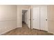 This cozy bedroom features neutral walls, wood floors, and a double door closet for ample storage at 29161 N Lilly Ln, San Tan Valley, AZ 85143