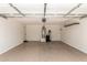 Spacious two car garage featuring an attached water heater, water filtration system, and convenient side door at 29161 N Lilly Ln, San Tan Valley, AZ 85143