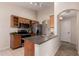 Functional kitchen with wood cabinets, stainless steel appliances, and an efficient layout at 29161 N Lilly Ln, San Tan Valley, AZ 85143
