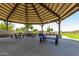 A covered pavilion with picnic tables provides a comfortable space for outdoor gatherings at 29161 N Lilly Ln, San Tan Valley, AZ 85143
