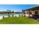 Inviting community pool with lounge chairs, shade pavilions, and lush landscaping offers a resort-like experience at 29161 N Lilly Ln, San Tan Valley, AZ 85143