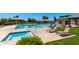 Resort-style pool and spa with lounge seating is surrounded by meticulously maintained landscaping at 29161 N Lilly Ln, San Tan Valley, AZ 85143