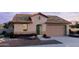 Charming single-story home featuring a welcoming entrance, a two-car garage, and stylish desert landscaping at 2953 E Mecklenburg Way, San Tan Valley, AZ 85143