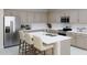 Modern kitchen featuring stainless steel appliances, a large island with a sink, and ample cabinet space at 2953 E Mecklenburg Way, San Tan Valley, AZ 85143