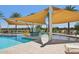 Community splash pad and pool area featuring colorful play structures under a large shade sail at 2953 E Mecklenburg Way, San Tan Valley, AZ 85143