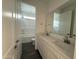Modern bathroom with double sinks, sleek countertops, and a bathtub and shower at 3013 E Mecklenburg Way, San Tan Valley, AZ 85143