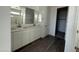 Elegant bathroom with double vanity, stylish mirrors, and a shower-tub combination at 3013 E Mecklenburg Way, San Tan Valley, AZ 85143